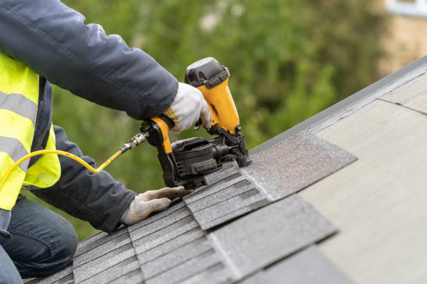istockphoto-1172013285-612x612 Unrecognizable roofer worker in uniform work wear using air or pneumatic nail gun and installing asphalt or bitumen tile on top of the roof under construction house