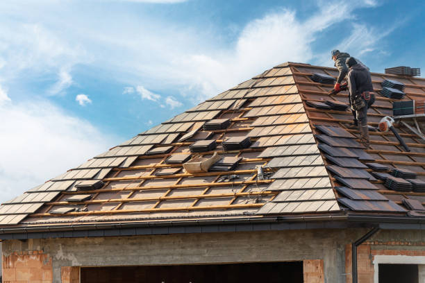 istockphoto-1445532563-612x612 process of building, roofer workers installing grey metal tile on top of roof with wooden frame outdoors on blue sky background